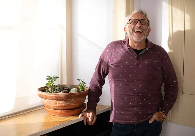 Older PLHIV man smiling