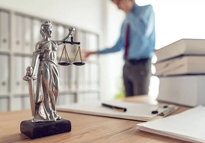 Lawyers desk with scales of justice